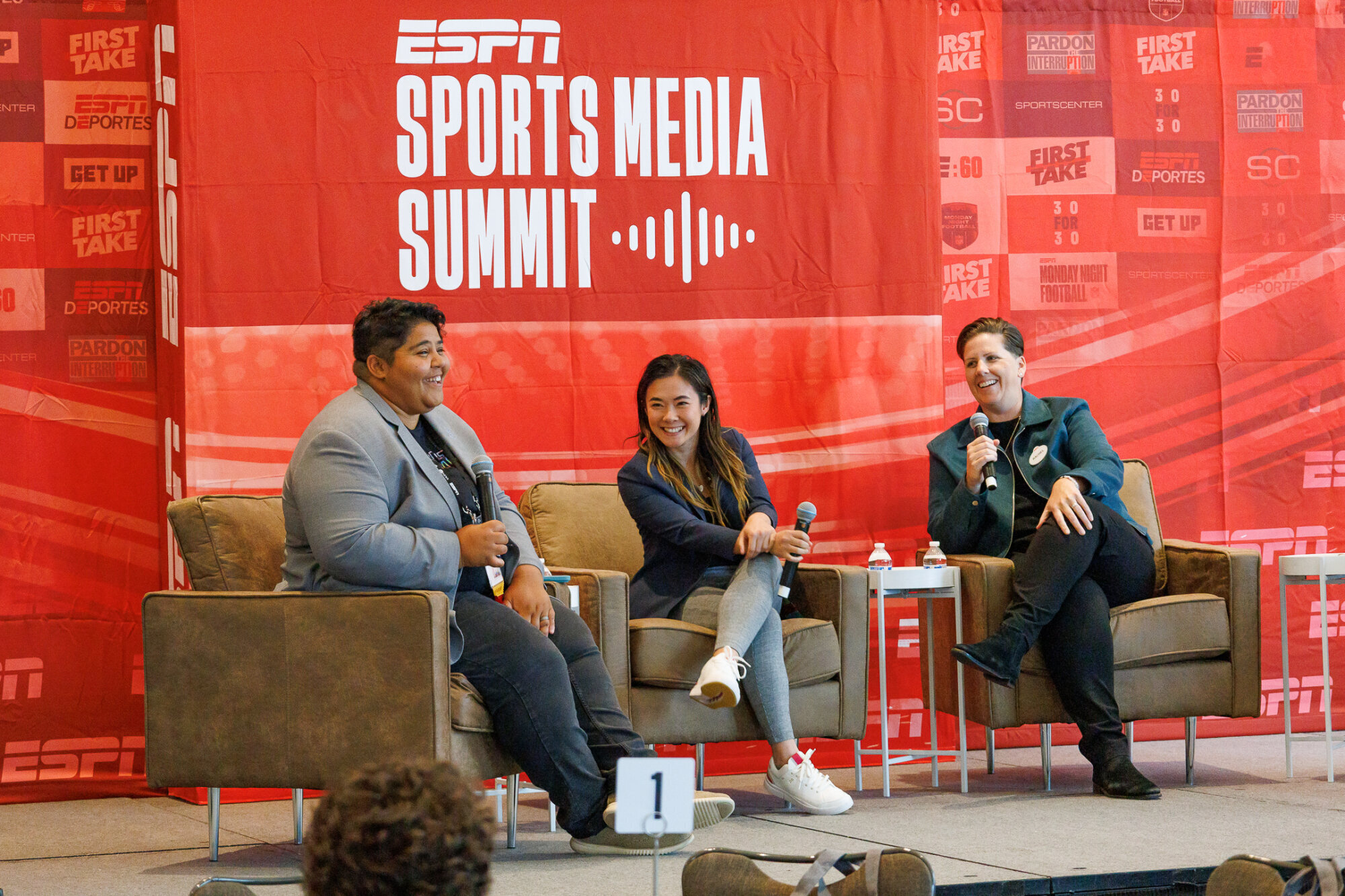 Katie Barnes and Rachel Pearson sit on stage for an ESPN panel.