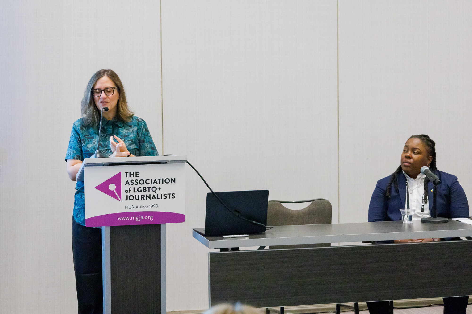 Dana Piccoli presents at a panel with Anna DeShawn.