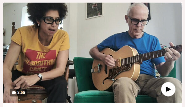 Mama & Phil rehearsing with guitar