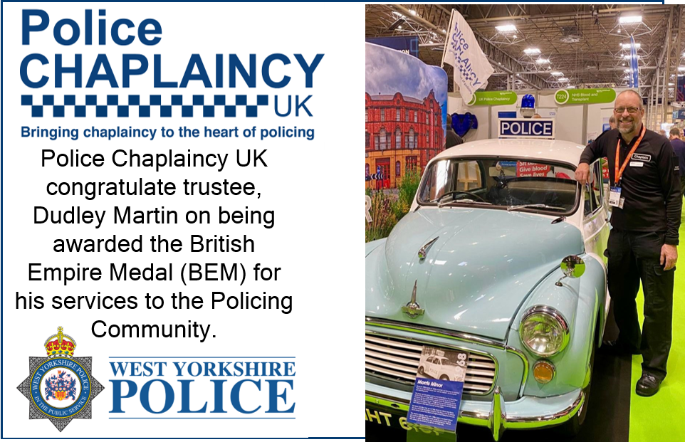 Dudley Martin stood beside a vintage police car
