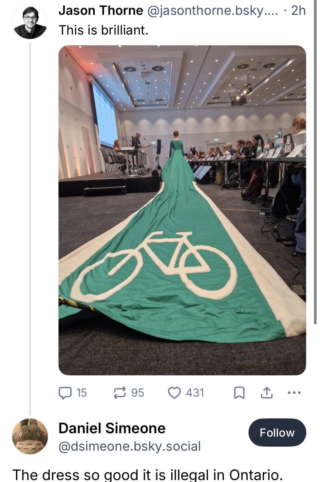 Woman wears dress with long train representing a cycle lane