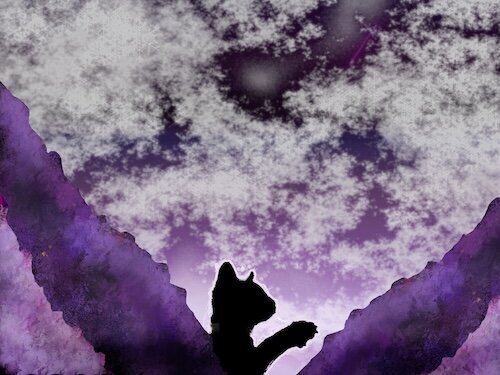 A kitten silhouetted against a purple sky and mountains
