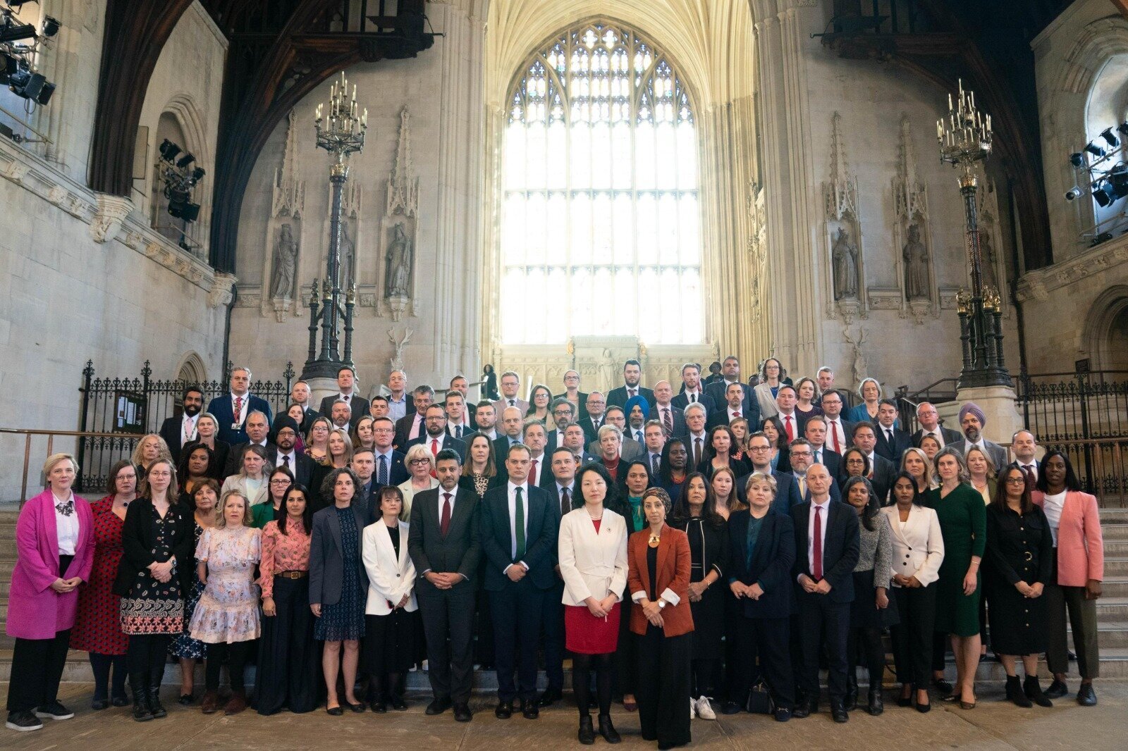 Abtisam and a student look through her work