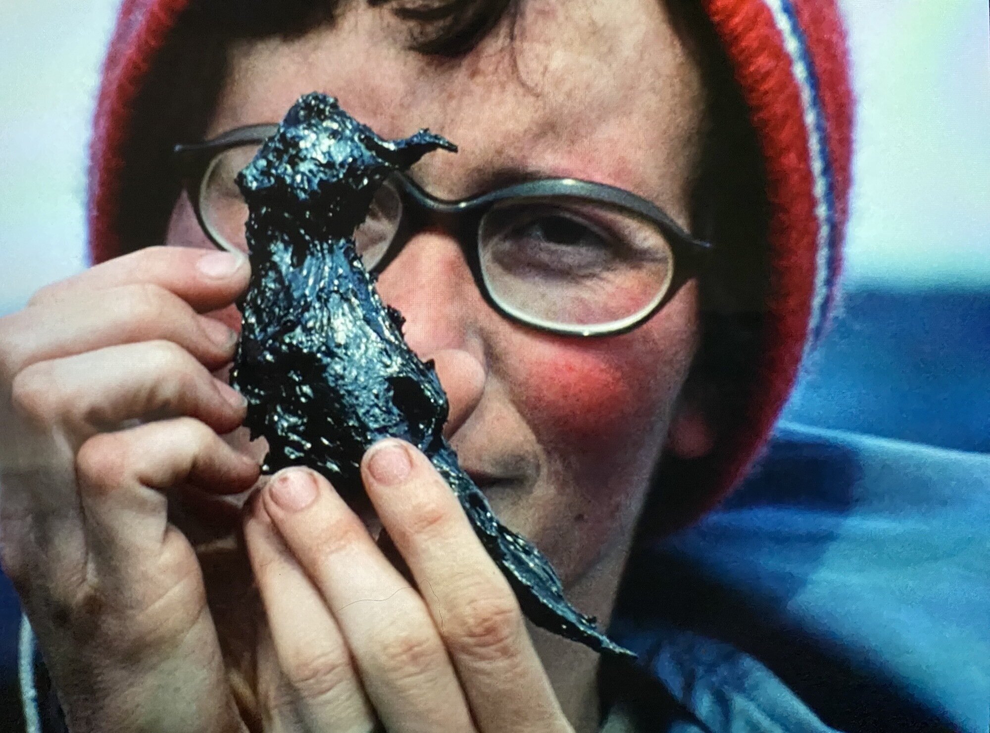 Woman holding a bird turned to stone by magma