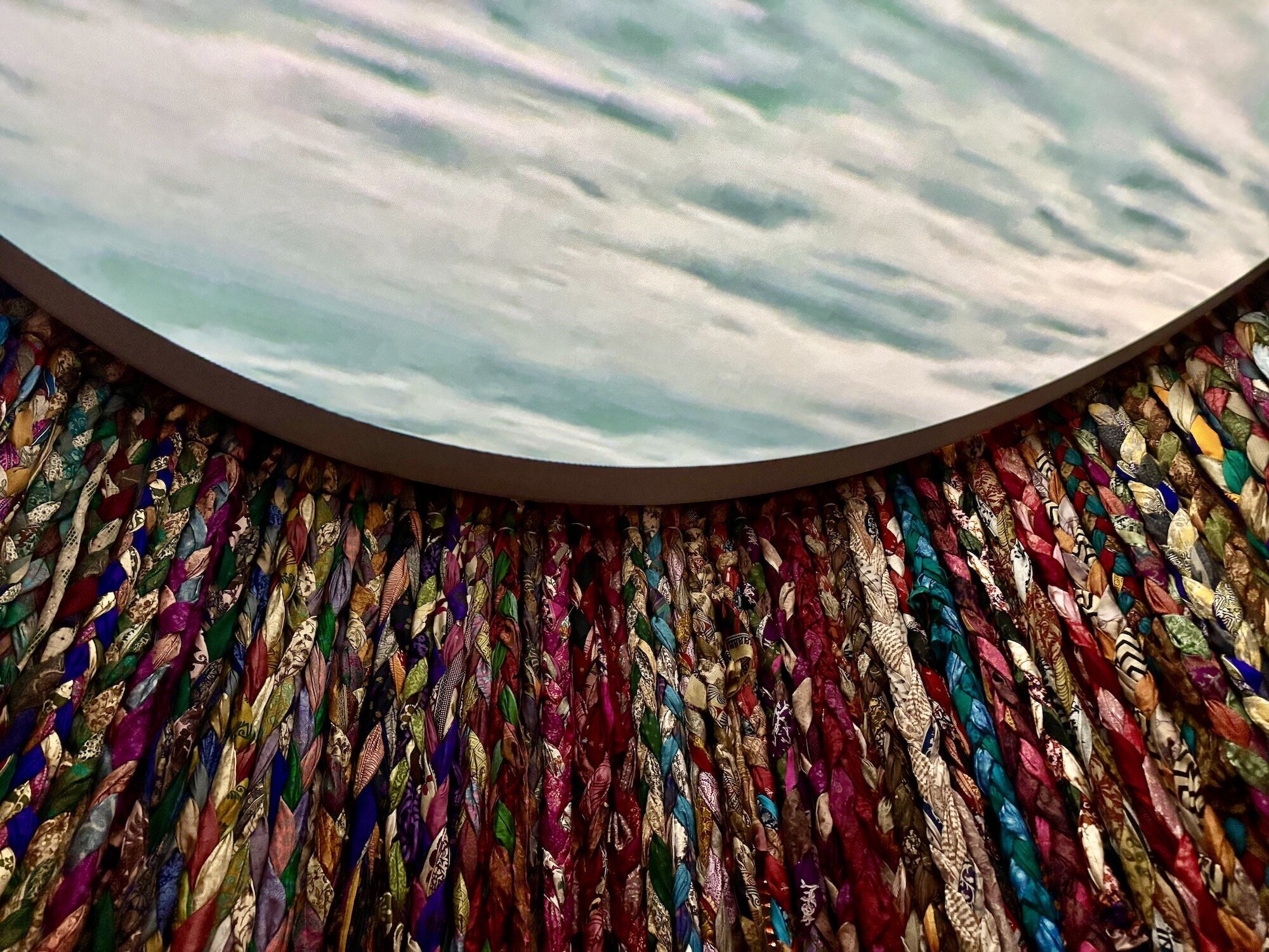 Art piece with woven saris and video projection