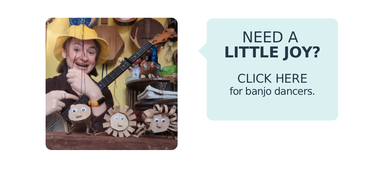 A photo of a banjo player with cardboard creatures, alongside the text "Need a little joy? Click here for banjo dancers."