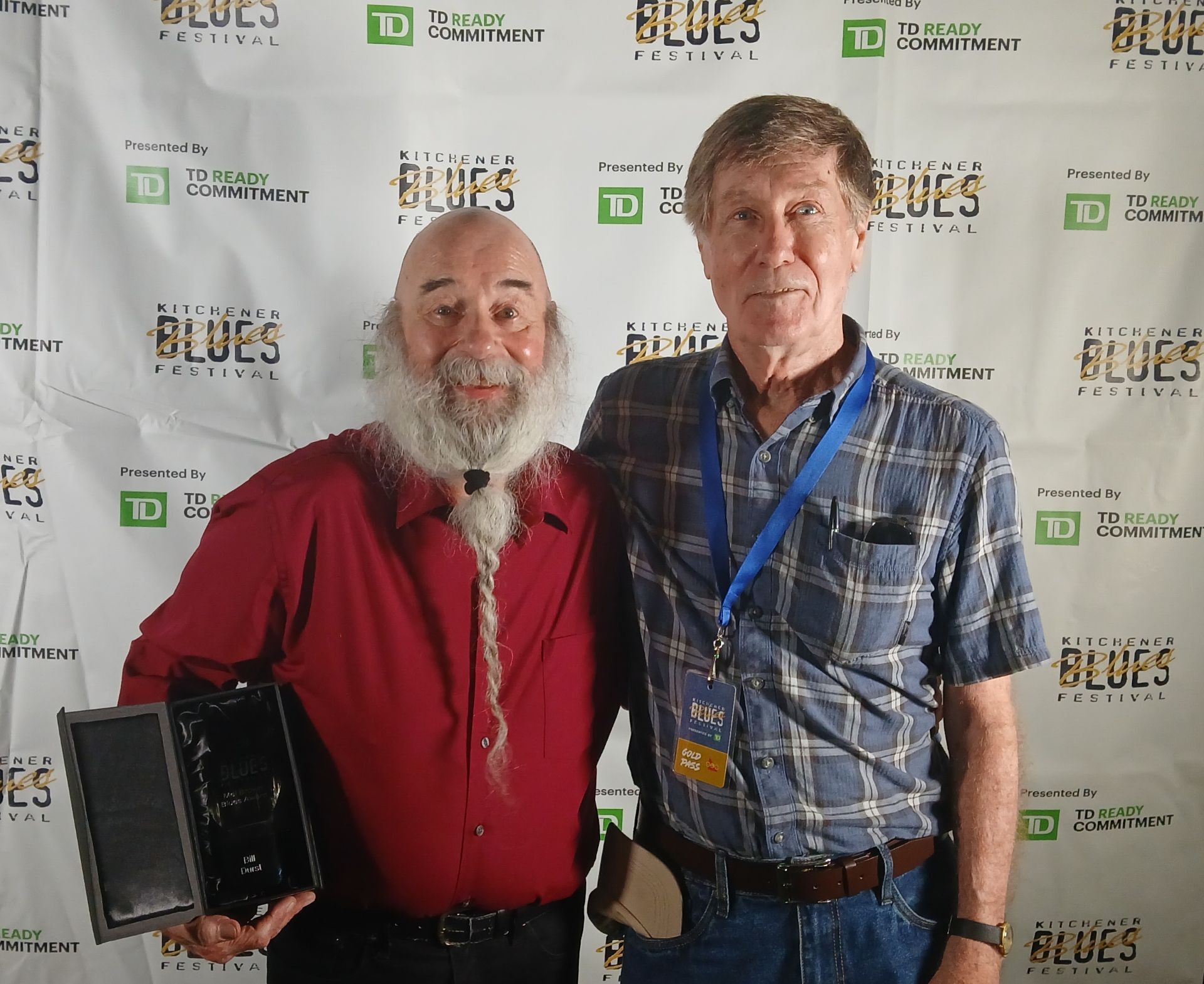 Bill is congratulated by Greg Hambleton